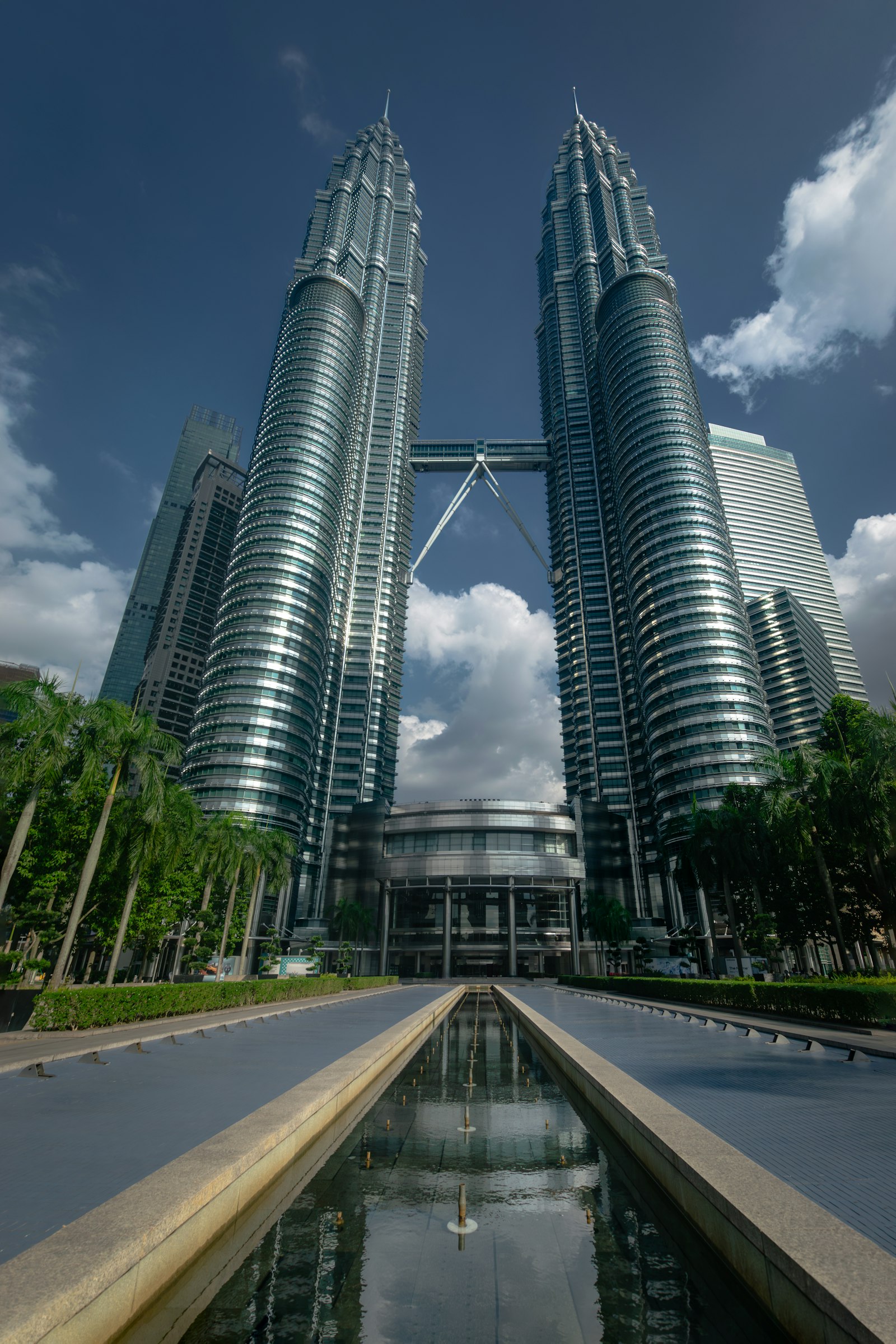 Petronas Towers rising over KLCC Park at dusk