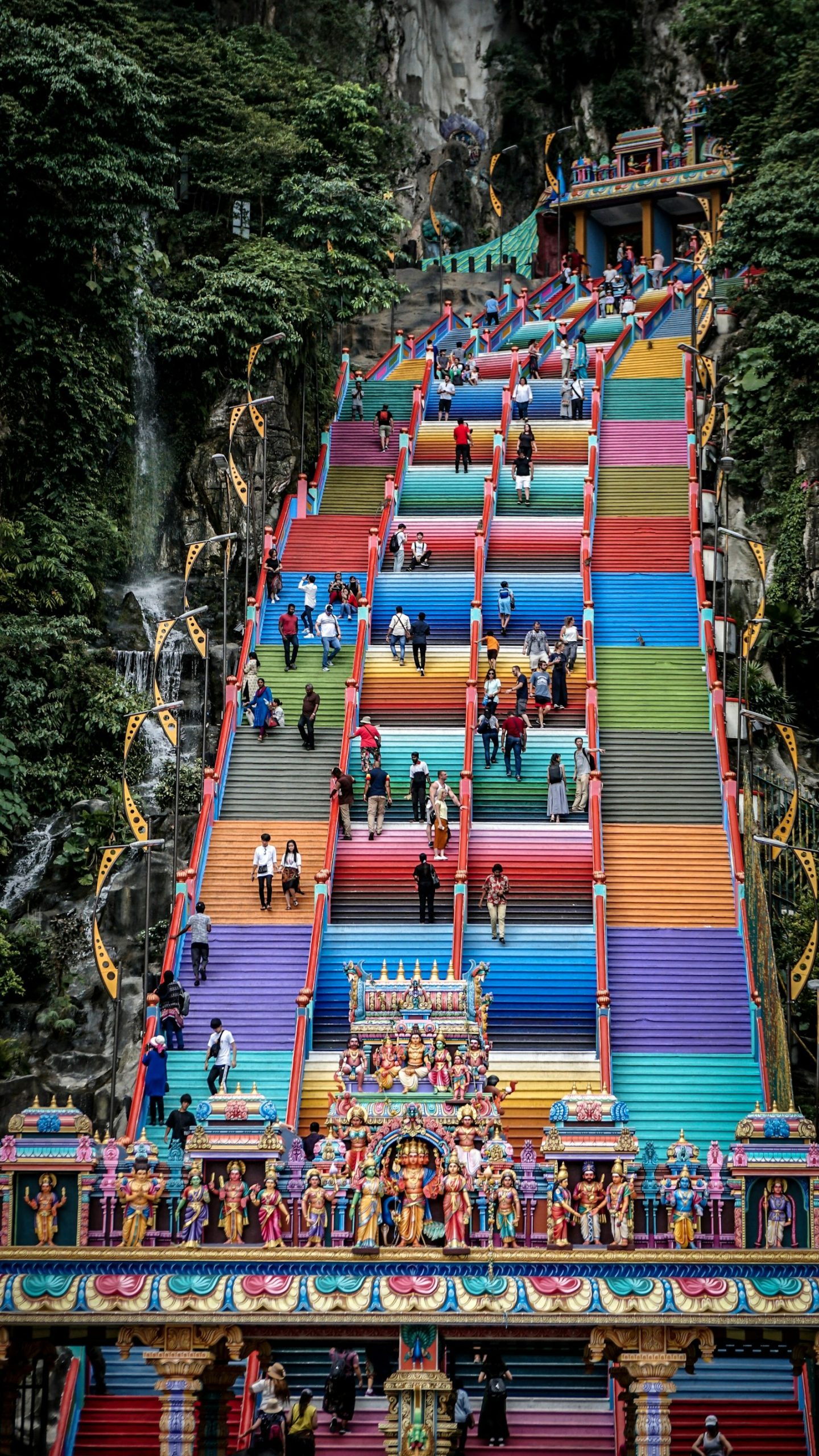 The golden Lord Murugan statue and rainbow-painted steps at Batu Caves