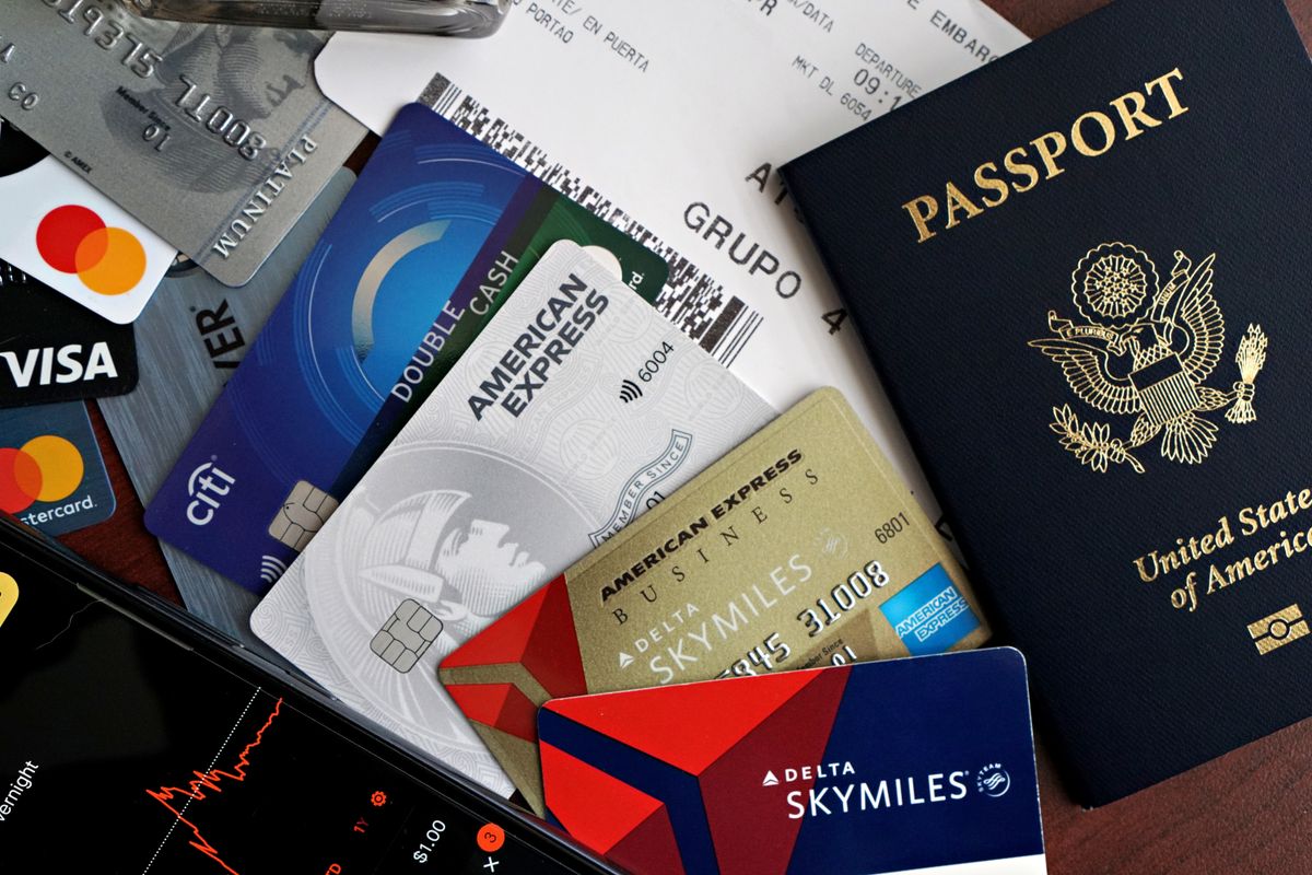 Is travel insurance worth it - passport, credit cards, and boarding pass travel essentials